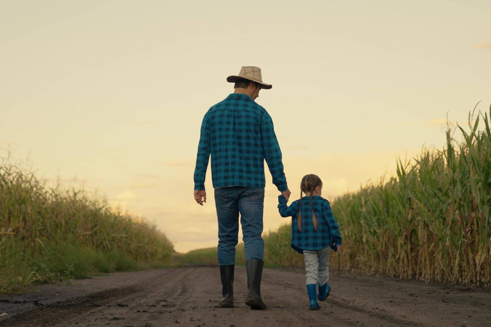 Weller Insurance | father and daughter walking and holding hands